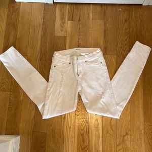 Hudson white skinny jeans with knee rips and distressed detail